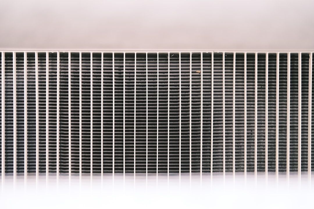 Close-up of a finned intercooler core with vertical support bars