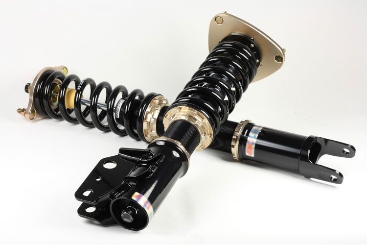 Black adjustable coilover struts with springs and mounting brackets