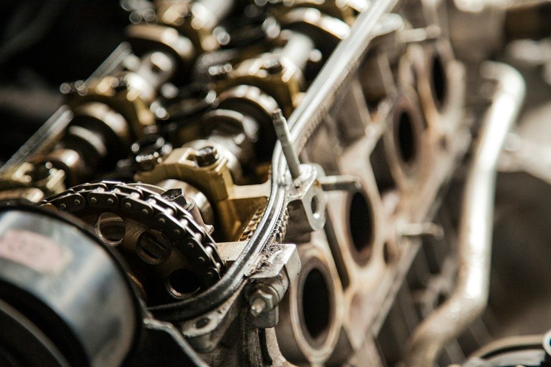 Close-up of an exposed engine head with camshaft and timing chain